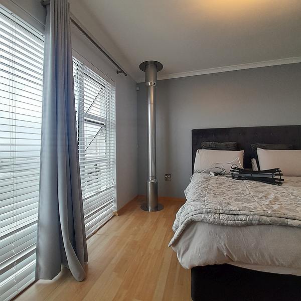Warm the bedroom with a double storey chimney through floor