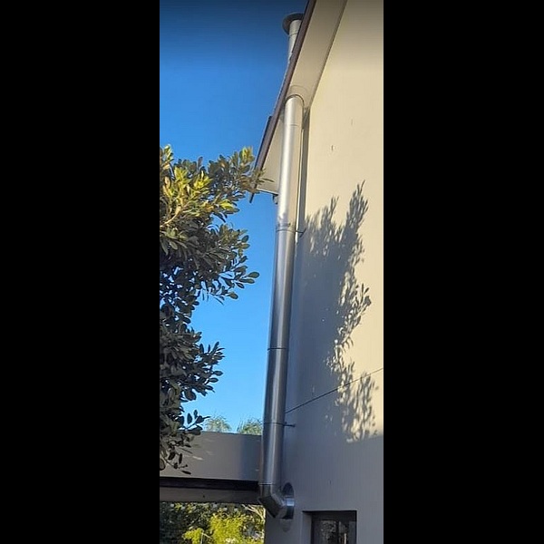 double storey chimney installed up the outside of building